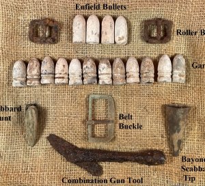 Display of Confederate Cartridge Box Contents and Parts, Belt Buckle, Gun Tool, and Bayonet Scabbard Hardware
