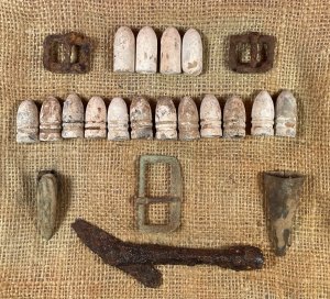 Display of Confederate Cartridge Box Contents and Parts, Belt Buckle, Gun Tool, and Bayonet Scabbard Hardware