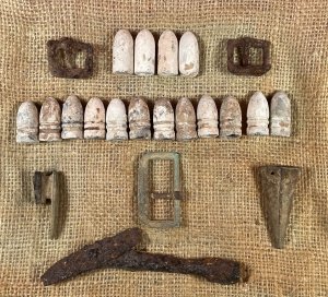 Display of Confederate Cartridge Box Contents and Parts, Belt Buckle, Gun Tool, and Bayonet Scabbard Hardware