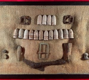 Display of Confederate Cartridge Box Contents and Parts, Belt Buckle, Gun Tool, and Bayonet Scabbard Hardware